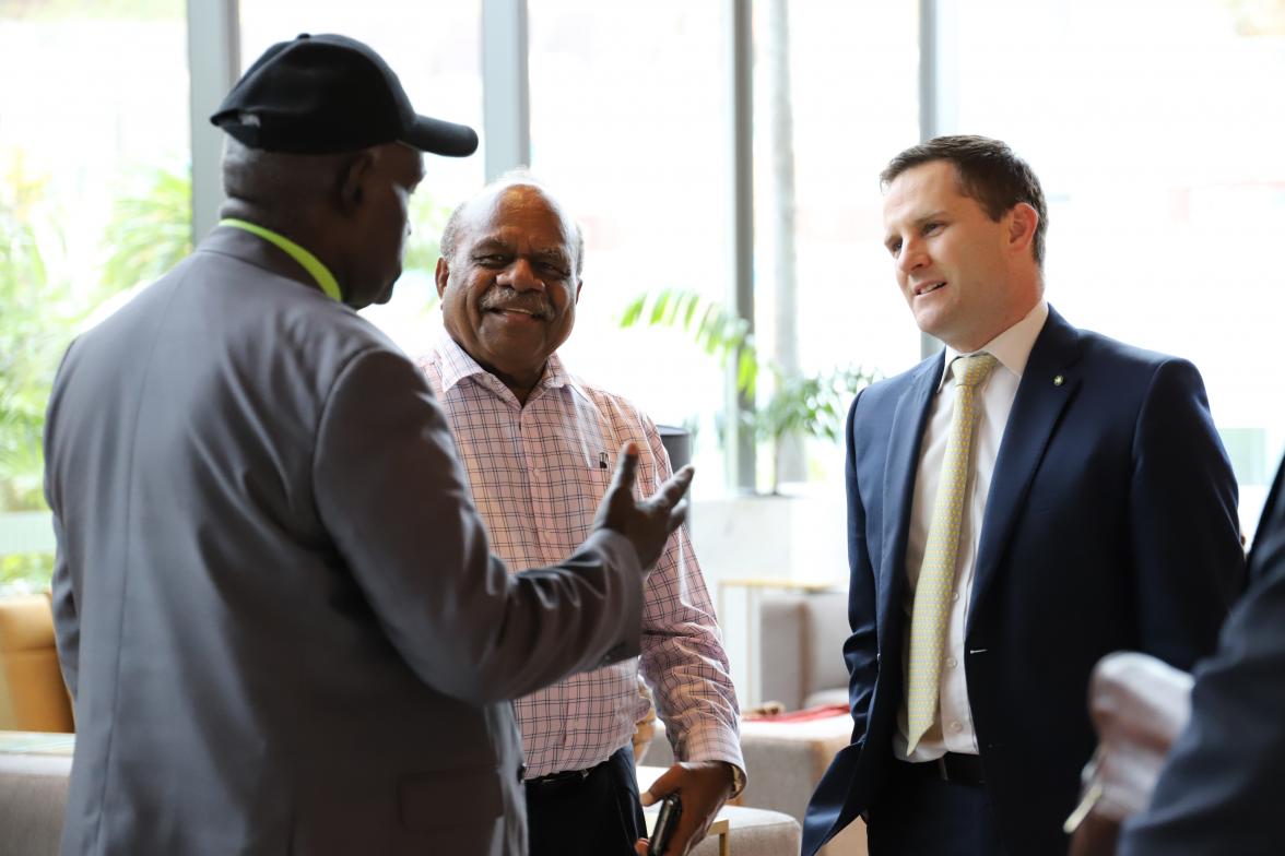 Photo of discussion between the Minister for International Development and the Pacific, the Hon Alex Hawke MP and former PNG Prime Minister, Sir Rabbie Namaliu conversing with former PNG Consul General-Brisbane, Paul Nerau.